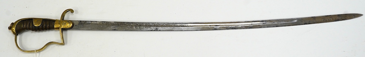 A Turkish WWI artillery sword, etched blade, Vanran Tagirian, Constantinople, brass stirrup hilt and horn grip, blade 70.5cm. Condition - fair, well worn